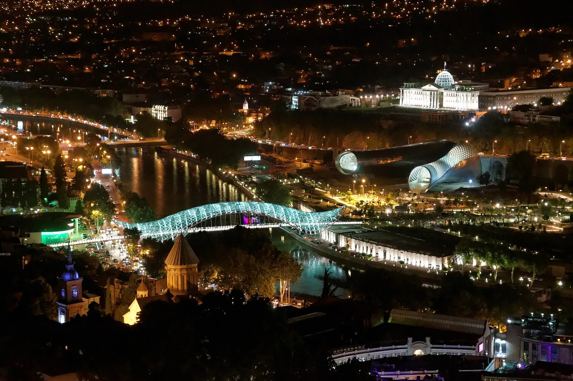 Tbilisi at night: the Peace Bridge and the Mtkvari river